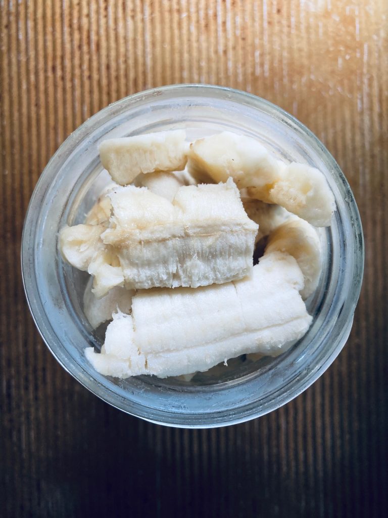 frozen banana pieces in a mason jar