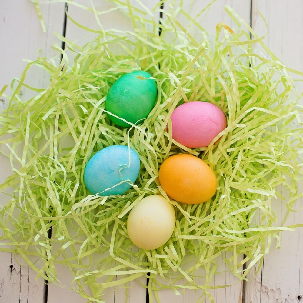 Easter eggs on paper grass