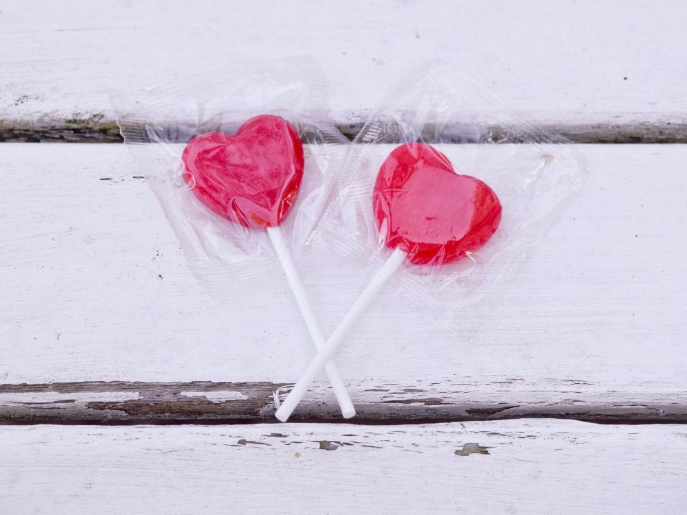 two heart-shaped lollipops